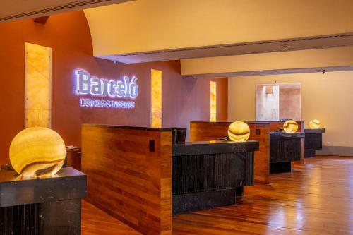 a barber shop with a sign that reads barber collective at Barceló Monterrey Valle in Monterrey