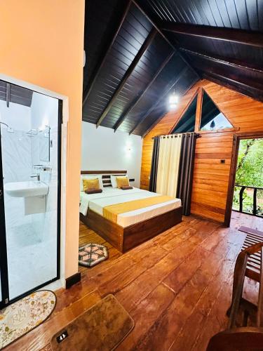 a bedroom with a bed and a shower and a sink at Mango Garden Eco Resort sigiriya in Sigiriya