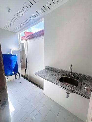 a kitchen with a sink and a counter top at Home Vacation in Ormoc City in Catmon