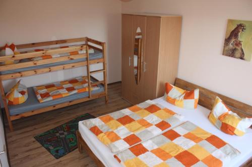 a bedroom with two bunk beds next to a door at Schwalbe in Saal
