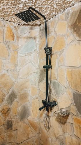 a street light attached to a stone wall at Unique Homestay in Karatu