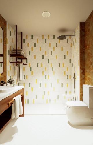 a bathroom with a shower and a toilet and a sink at Sao Miguel Park Hotel in Ponta Delgada