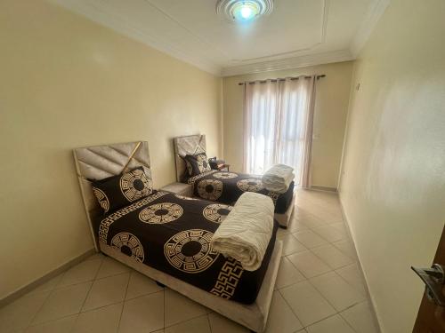 a bedroom with two beds and a window at Perfect stay in Agadir