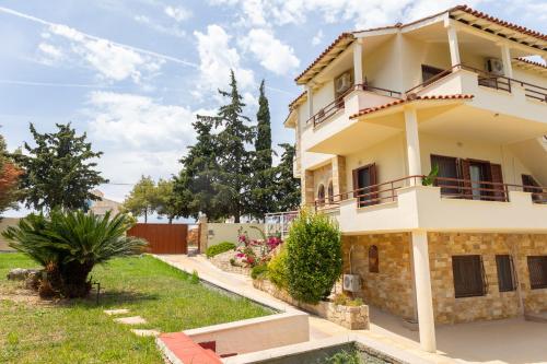 a villa with a view of a house at Casa Stefanos in Afitos