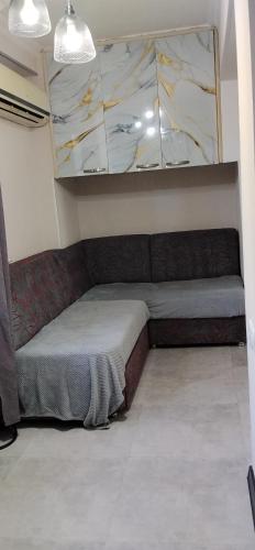a room with a bed in the corner of a room at kvartira in Kutaisi