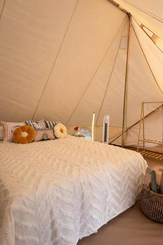 a bedroom with a bed in a tent at Hanımın Çiftliği Tents&Drinks in Fethiye