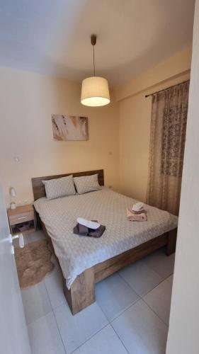 a bedroom with a large bed in a room at Venetia' s house in Kalamata