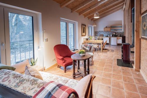 a living room with a couch and a table at Ferienwohnung Zum Bachsee in Chorin