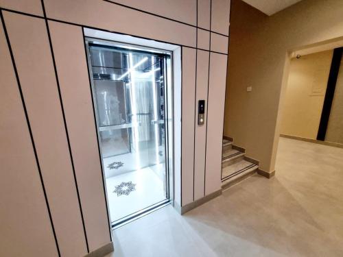 a room with an empty refrigerator in a building at مساكن للشقق الفندقيه in Riyadh