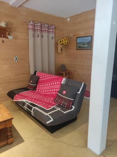 a bed sitting inside of a room with at Chez So et Compagnie in Saint-Gérand-de-Vaux