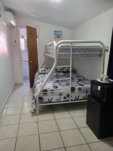 a bedroom with a bunk bed in a room at Coco Sol 1 by MyMiamiStay in Miami