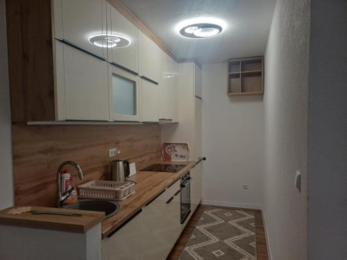 a small kitchen with a sink and a counter at Villa Una Verde in Bosanska Krupa
