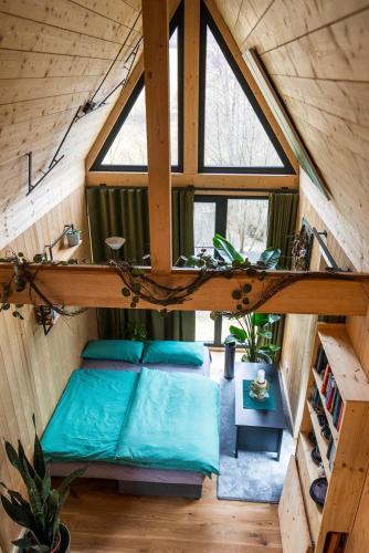 a room with four pillows in a tiny house at Taunus Tinyhouse - Sauna, Grillplatz & Naturidylle in Weilrod