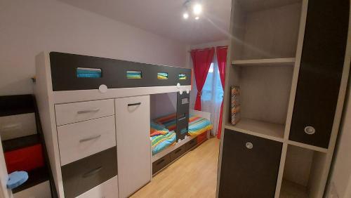a small bedroom with a bed and a closet at DANAGUEST in Los Llanos de Aridane