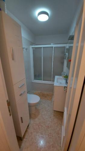 a bathroom with a toilet and a sink at DANAGUEST in Los Llanos de Aridane