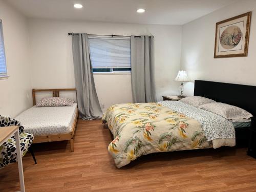 a bedroom with two beds and a window at BM master suite in Mountain View in Mountain View