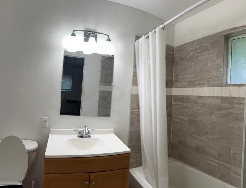 a bathroom with a sink and a toilet and a mirror at BM master suite in Mountain View in Mountain View