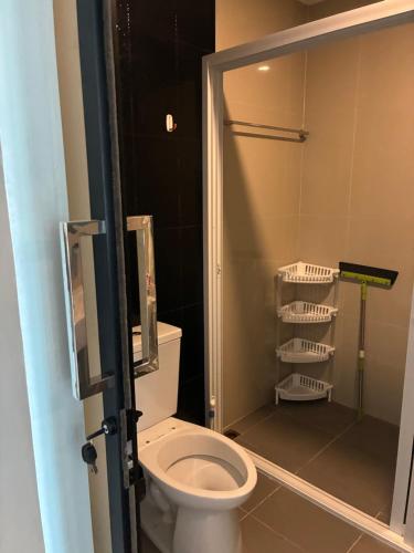 a bathroom with a toilet and a walk in shower at Beach Front Condo Centerviews Bangsaray Floor 7 in Bang Sare