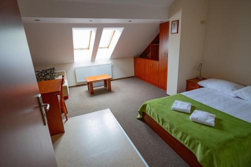 a small bedroom with a bed and a window at Uroczysko Porszewice - Ośrodek Rekolekcyjno-Konferencyjny koło Łodzi in Łódź