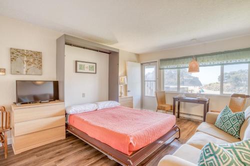 a bedroom with a bed and a tv and a couch at Neskowin Resort 114 in Neskowin