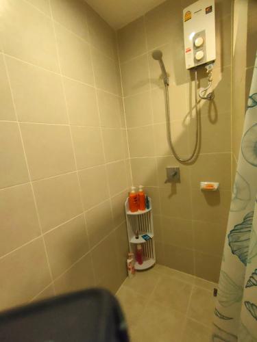 a bathroom with a shower with a shower at wongwian N in Ban Bo Khaem