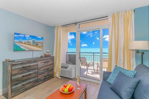a living room with a couch and a view of the ocean at Boardwalk 1139 & 1140 in Myrtle Beach