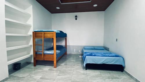 a room with two bunk beds in a room at Casa Largo Katayama in Ruiosucio