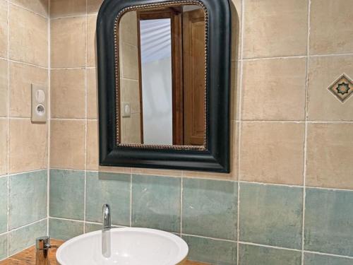 a bathroom with a sink and a mirror at Gîte de charme rénové 3 épis, 2 chambres en pleine nature - FR-1-496-92 in Palogneux
