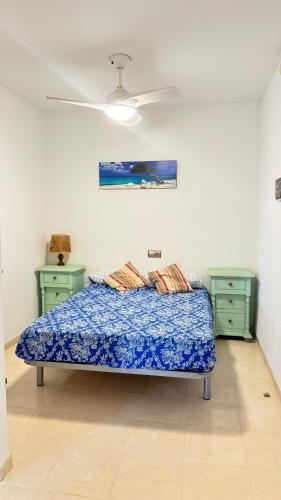 a bedroom with a bed and two night stands at La Envía Terraza in La Envia