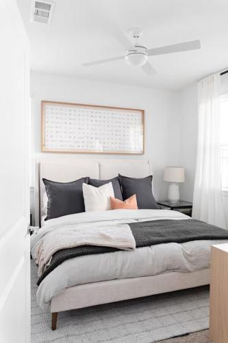 a white bedroom with a large bed and a window at Luxury 1bedroom 1bath Tech Hub in Austin