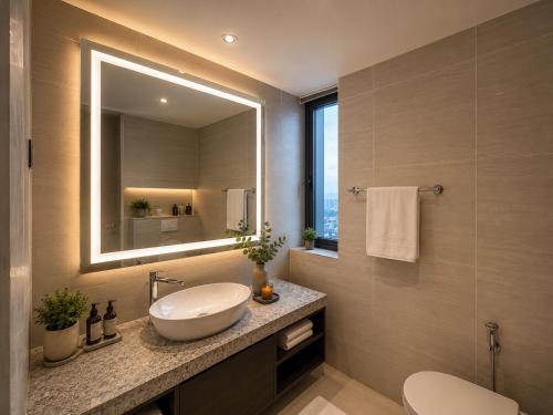 a bathroom with a sink and a mirror at STAR Residence KLCC - Dreamland Holiday Home in Kuala Lumpur