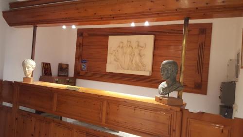 a museum with a bust of a woman on a counter at Varmy in Ierápetra