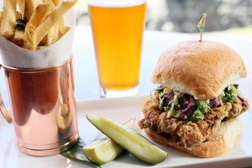 a sandwich and fries and a drink and a pickle at Volcano House in Volcano