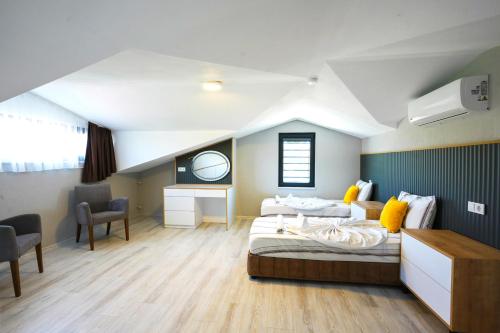 a hospital room with two beds and a desk at Dolunay Villas - 2 in Dalyan