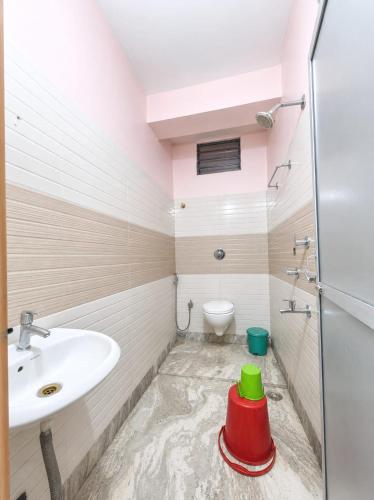 a bathroom with a sink and a toilet at DAS HOTEL in Darjeeling
