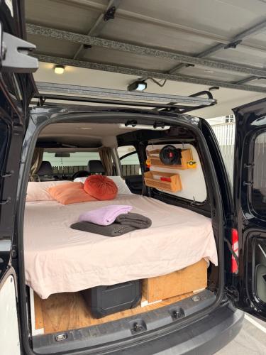 a bed in the back of a van at Caddy Car in Brisbane