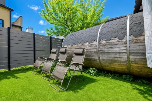 a group of chairs sitting next to a fence at tocoro. Mt. Fuji Hazuki in Fujikawaguchiko