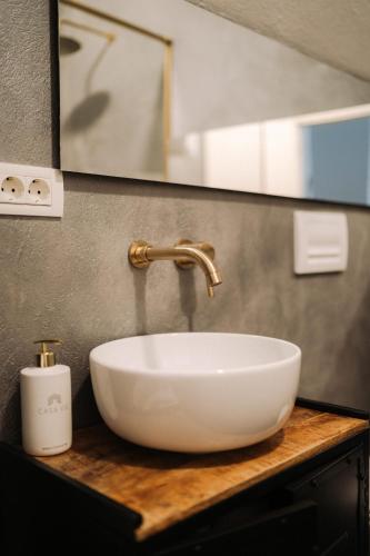 a white sink on a counter in a bathroom at Porumbacu134 in Porumbacu de Sus