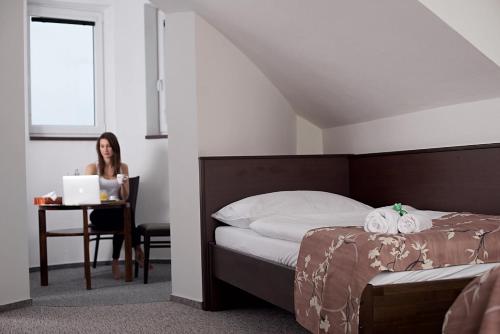 Posteľ alebo postele v izbe v ubytovaní Penzion Dobré Hnízdo