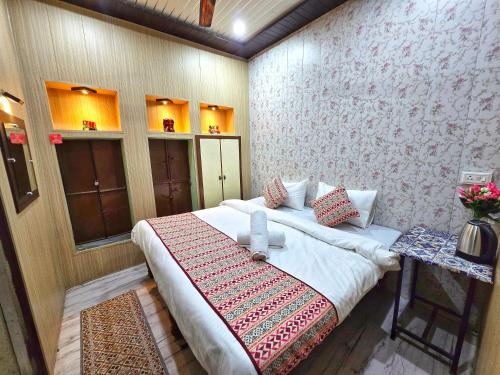 a bedroom with a large bed in a room at Zipcode Kashi in Varanasi