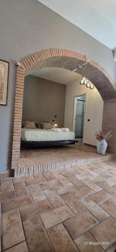 a bedroom with a bed in the middle of a room at A Casa di Dody in Guidonia