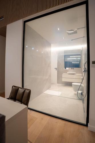 a glass window of a bathroom with a toilet at Villa FUX Eternity 3 in Ždrelac