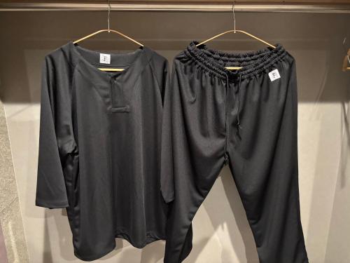 two shirts and pants are hanging on a rack at B-sum M-1 in Matsuzaka