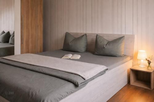 a bed with two pillows on it in a bedroom at Ferienhaus Flotte Biene Buggow nahe Usedom in Rubkow