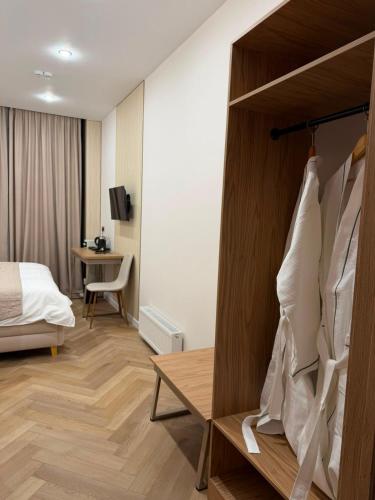 a hotel room with a bed and a desk at Luxoria hotel in Astana