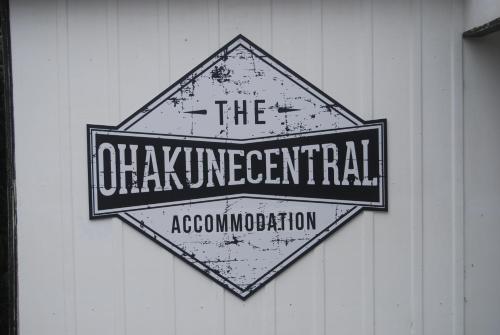 a sign on a building that reads the enchanted association at The Ohakune Central Cabins in Ohakune