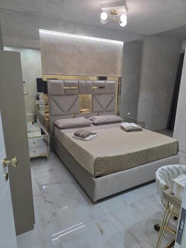 a bedroom with a large bed in a room at B&B la marica in Adrano