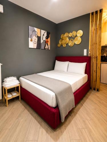 a bedroom with a large bed in a room at GPX CLR - MicroLuxe Suite in Larisa