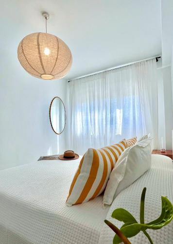 a bedroom with a large bed with a window at casArena 1 in Las Negras