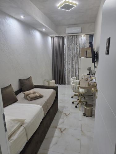 a bedroom with a bed and a sink in it at B&B la marica in Adrano